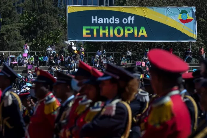 In this file photo Ethiopians are seen protesting against outside interventions in the conflict in the country's northern Tigray region, at a demonstration held at a stadium in the capital Addis Ababa, Ethiopia on May 30, 2021 [AP Photo/Mulugeta Ayene]